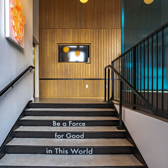 A view of the Sorin Medica entrance. On the stairs are printed the words, "Be a Force for Good in This World"